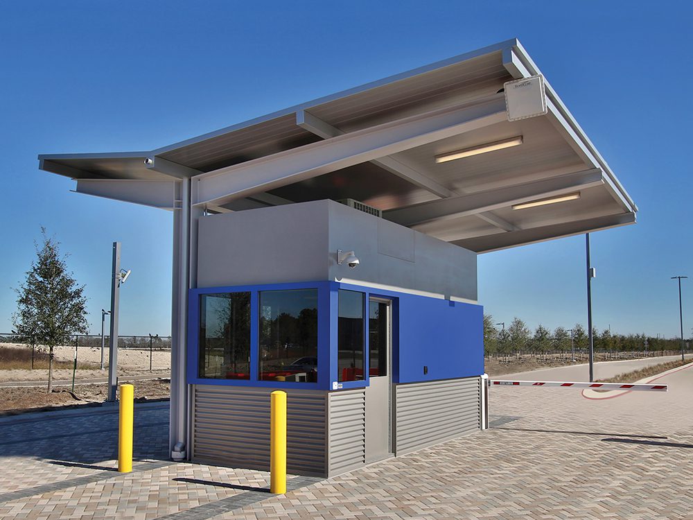 Blue and gray guard booth with large overhanging roof