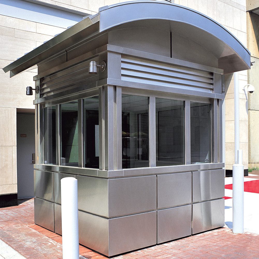 Silver-paneled guard booth with rounded roof