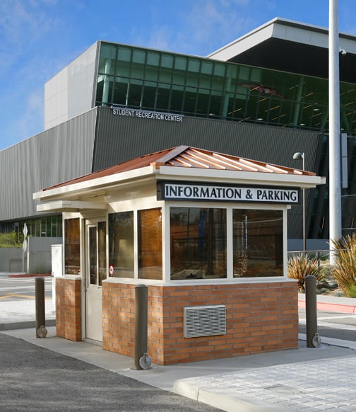 Brick information and parking booth on school campus